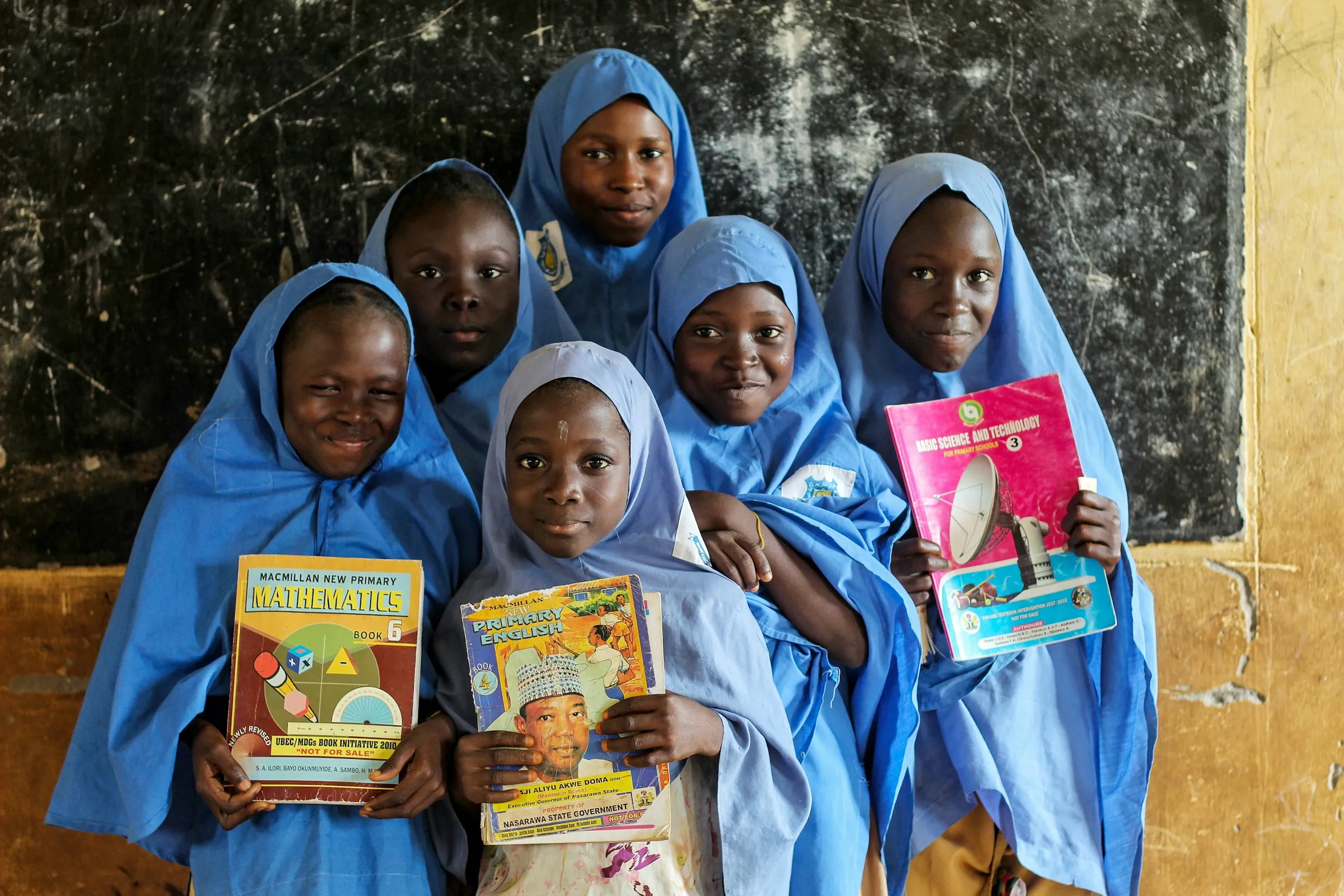 Schoolgirls holding books