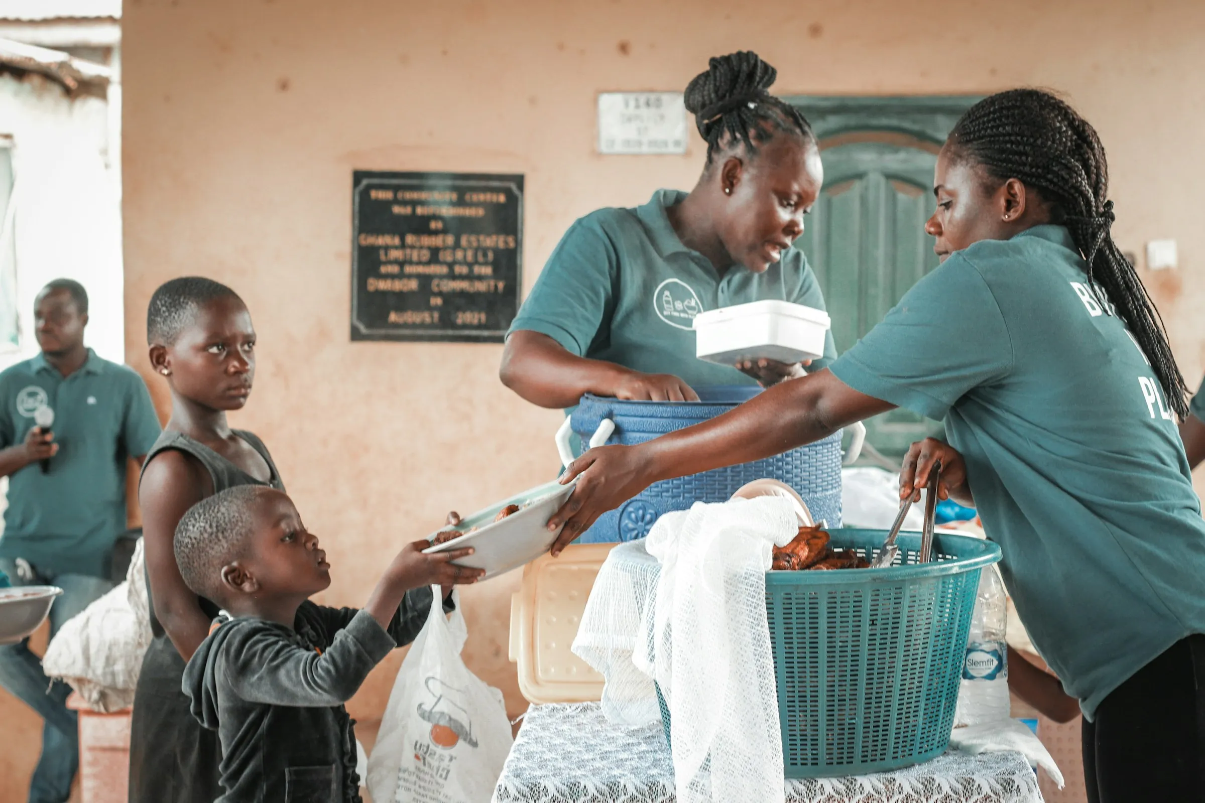Volunteers handing out supplies to families